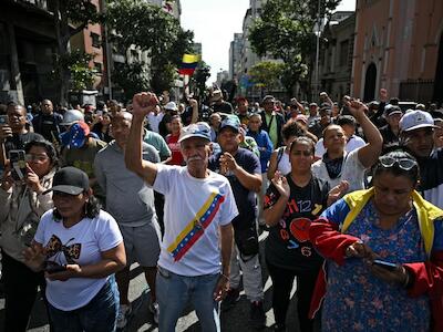 Mobilização popular no entorno do Palácio Miraflores, sede do governo venezuelano | Crédito: Federico PARRA / AFP